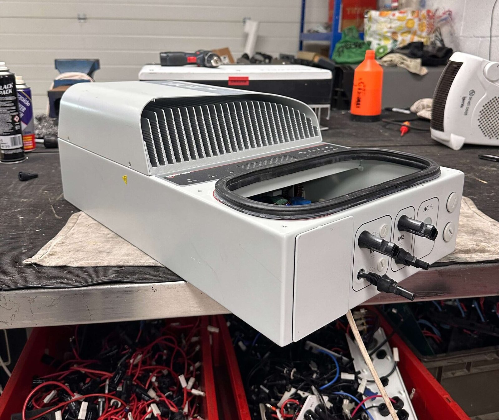 Solar inverter being tested on workbench at South West Renewables workshop